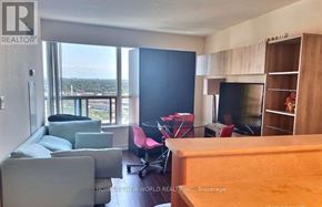 Toronto (Woburn) condo for rent - A living room with a couch, chairs, and a television.