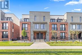 Waterloo townhouse for rent - A building with a red brick facade and a large entrance is shown.
