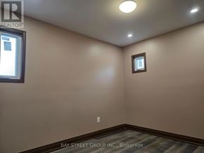 Toronto (Blake-Jones) apartment for rent - A room with a window and a small picture frame on the wall.