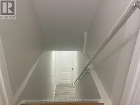 Vaughan (Vellore Village) apartment for rent - A hallway with a door at the end.