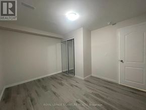 Vaughan (Vellore Village) apartment for rent - A room with a white door and a glass door.