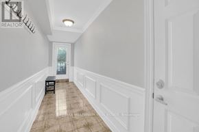 Vaughan (East Woodbridge) apartment for rent - A hallway with a bench and a door.