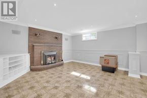 Vaughan (East Woodbridge) apartment for rent - A room with a fireplace and a box on the floor.