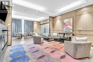 Toronto (Islington-City Centre West) condo for rent - A living room with a large rug and a couch.