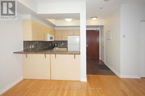 Ottawa condo for rent - A kitchen with a counter top and cabinets.