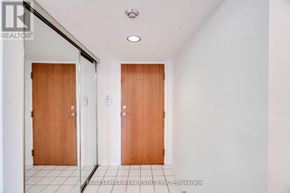 Vaughan (Brownridge) condo for rent - A hallway with two doors and a tiled floor.