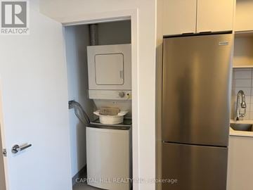 Toronto (West Hill) condo for rent - A stainless steel refrigerator in a kitchen with a white door.