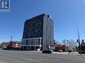 Toronto (West Hill) condo for rent - A tall building with a sign that says "KALTURE" on the side of it.