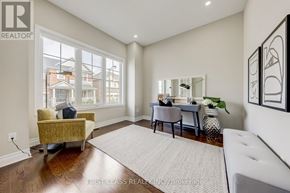 Aurora (Aurora Estates) apartment for rent - A well-lit room with a yellow chair and a white couch.