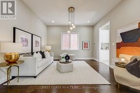 Aurora (Aurora Estates) apartment for rent - A well-lit, modern living room with a white sofa and a coffee table.