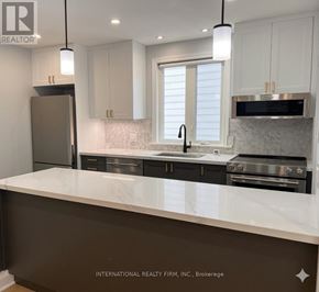 St. Catharines (Secord Woods) apartment for rent - A modern kitchen with a marble countertop and stainless steel appliances.