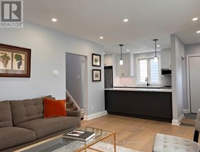 St. Catharines (Secord Woods) apartment for rent - A living room with a couch, a coffee table, and pictures on the wall.