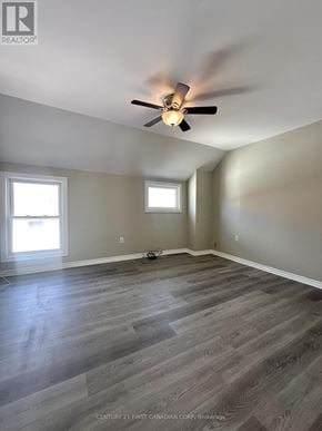 St. Thomas multi-family for rent - A room with a ceiling fan and two windows.
