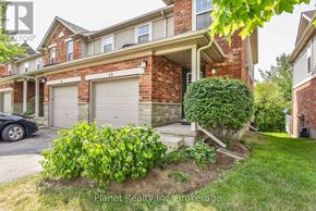 Guelph (Clairfields/Hanlon Business Park) townhouse for rent - A house with a car parked in front of it.