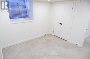 Innisfil (Lefroy) multi-family for rent - A white door is in a room with a window.