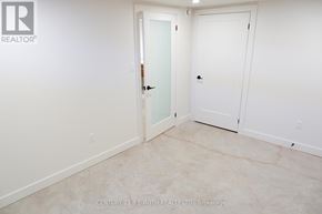 Innisfil (Lefroy) multi-family for rent - A white door is in a room with a white wall.
