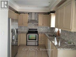 Vaughan (Vellore Village) apartment for rent - A kitchen with a refrigerator, oven, and sink.