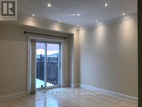 Vaughan (Vellore Village) apartment for rent - A room with a sliding glass door leading to a backyard.
