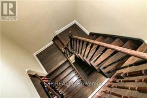 Vaughan (Vellore Village) apartment for rent - A wooden staircase with a handrail is shown in the image.