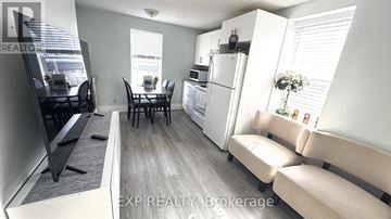 Niagara Falls (Dorchester) apartment for rent - A well-lit kitchen with a dining table and chairs.