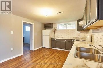 Whitby (Downtown Whitby) apartment for rent - A kitchen with a sink and a refrigerator.