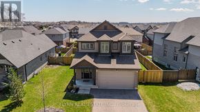 Norfolk (Simcoe) apartment for rent - A bird's eye view of a residential area with houses and a clear sky.