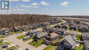 Norfolk (Simcoe) apartment for rent - A bird's eye view of a residential neighborhood with houses and a road.