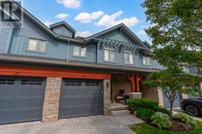Collingwood house for rent - A house with a blue and grey exterior and a red garage door.