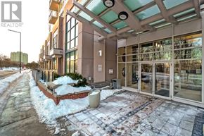 Toronto (Bendale) condo for rent - A building with a glass entrance and a snow-covered ground.