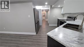 Hamilton apartment for rent - A kitchen with a marble countertop and a refrigerator.