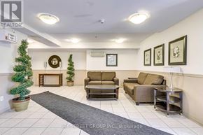 Toronto (Clairlea-Birchmount) condo for rent - A living room with a couch, chair, and a small tree in a pot.