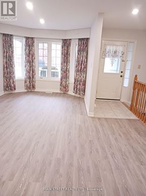 Georgina (Keswick South) apartment for rent - A room with wooden flooring and a white door.