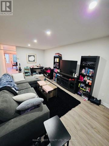 Georgina (Keswick South) apartment for rent - A living room with a grey couch and a black coffee table.