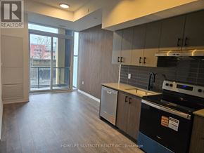 Burlington (Alton) condo for rent - A kitchen with a black dishwasher and a black oven.