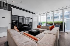 Toronto (Church-Yonge Corridor) condo for rent - A modern living room with a large couch and a television.