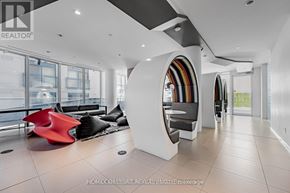 Toronto (Church-Yonge Corridor) condo for rent - A modern living room with a red sculpture and a white circular structure.