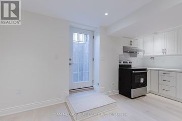 Mississauga (Churchill Meadows) apartment for rent - A white kitchen with a black oven and white cabinets.