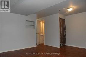 Kitchener townhouse for rent - A room with a door and a window with curtains.