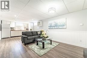 Hamilton apartment for rent - A living room with a grey couch and a glass coffee table.