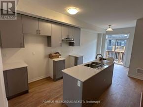 Oshawa (Donevan) townhouse for rent - A kitchen with a sink and a window.