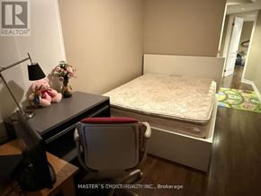 Newmarket (Woodland Hill) apartment for rent - A bedroom with a bed, desk, and chair.