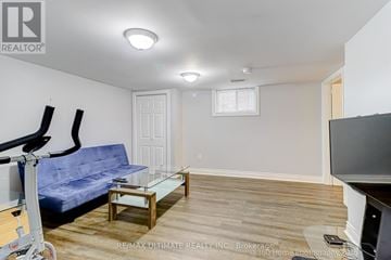 Toronto (Wexford-Maryvale) apartment for rent - A living room with a blue couch and a glass coffee table.