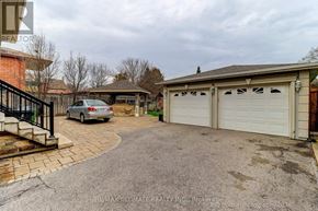 Toronto (Wexford-Maryvale) apartment for rent - A car is parked in front of a house with a white garage door.