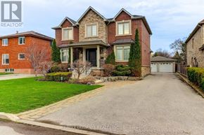 Toronto (Wexford-Maryvale) apartment for rent - A large, two-story house with a driveway in front.