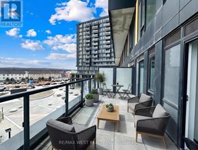 Burlington (Alton) condo for rent - A modern kitchen with a dining table set for two.