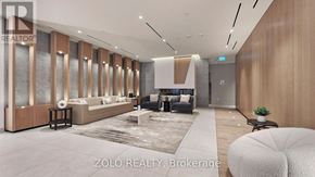 Toronto (Regent Park) condo for rent - A modern living room with a grey sofa and a white rug.