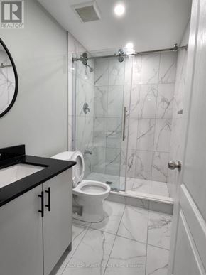 Innisfil (Alcona) apartment for rent - A bathroom with a marble tile shower and toilet.