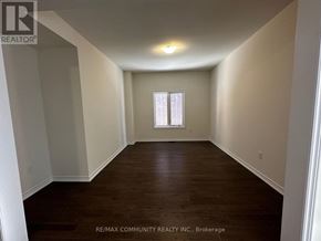 Oshawa (Eastdale) apartment for rent - A room with a window and wooden flooring.
