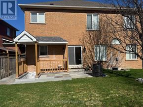 Richmond Hill (Rouge Woods) apartment for rent - A brick house with a porch and a tree in front.