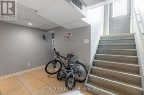 London East (East H) multi-family for rent - A room with a staircase and a bicycle.